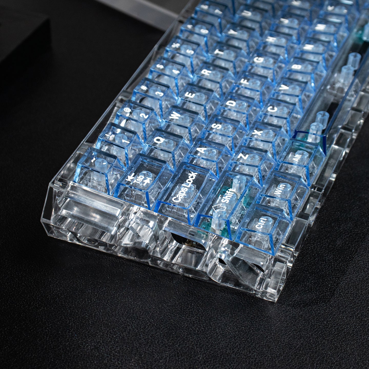 Light blue transparent mechanical keyboard keycaps with transparent PC material for customized keycaps.