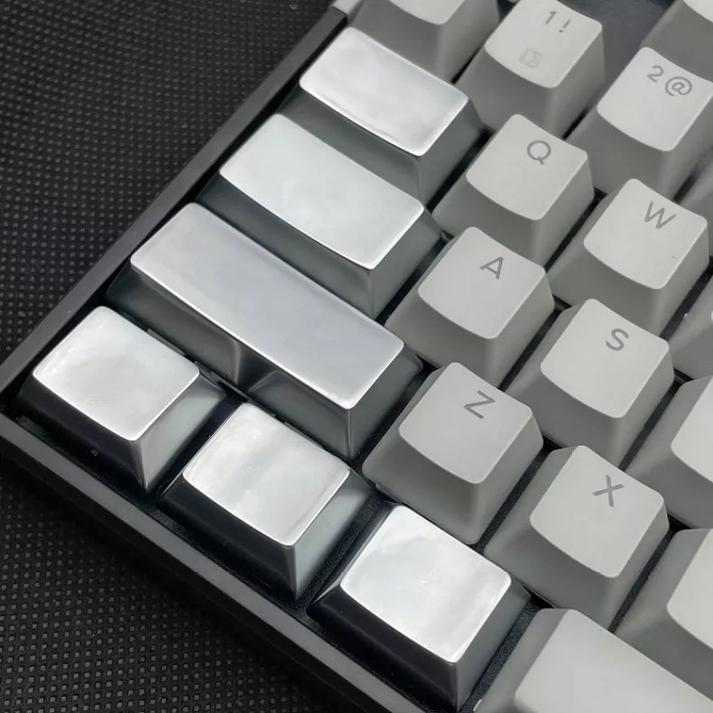 Metal material keycaps, personalized keycaps for large key positions. Metallic texture without engraving