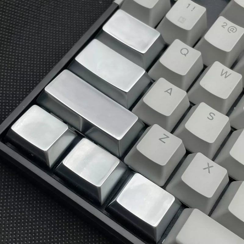 Metal material keycaps, personalized keycaps for large key positions. Metallic texture without engraving