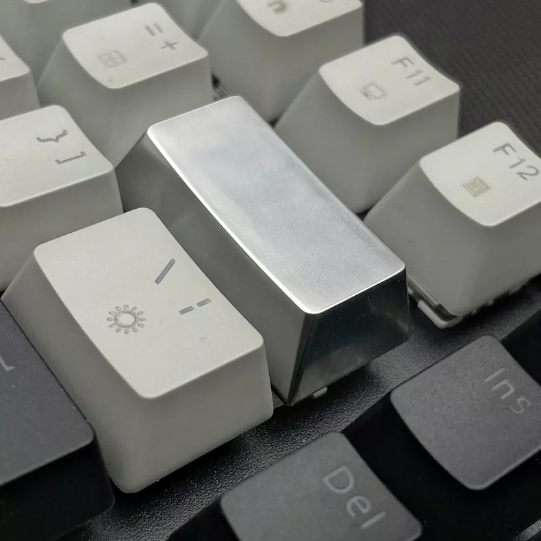 Metal material keycaps, personalized keycaps for large key positions. Metallic texture without engraving