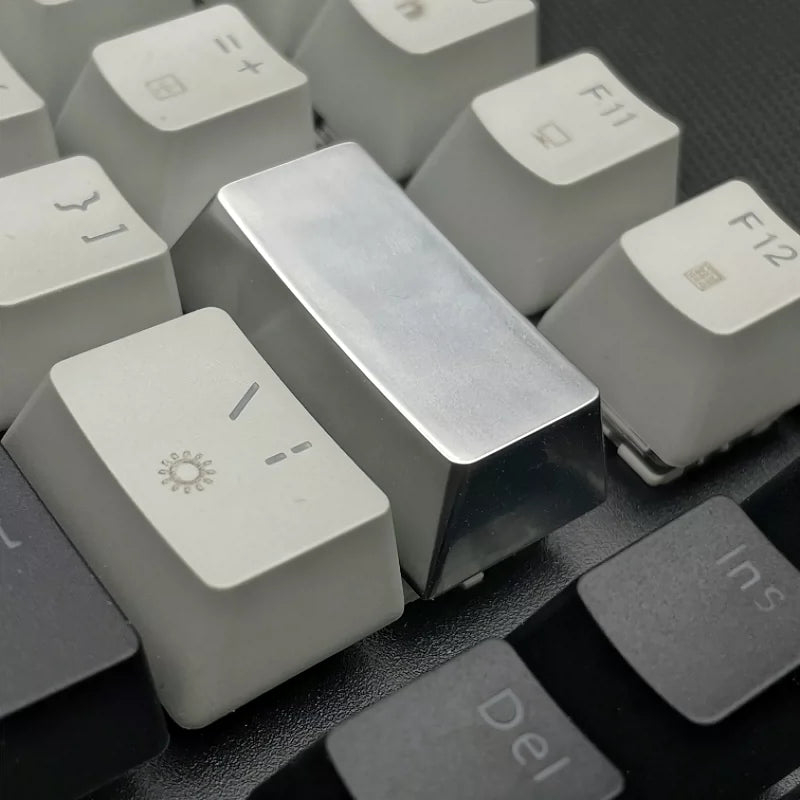 Metal material keycaps, personalized keycaps for large key positions. Metallic texture without engraving
