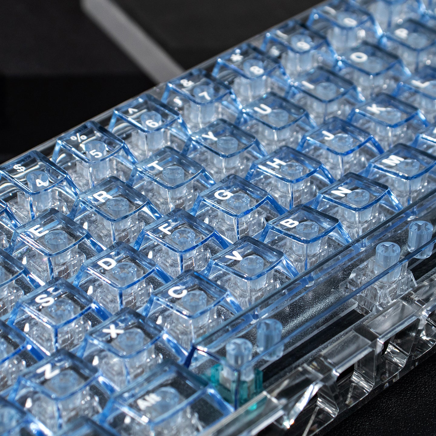 Light blue transparent mechanical keyboard keycaps with transparent PC material for customized keycaps.