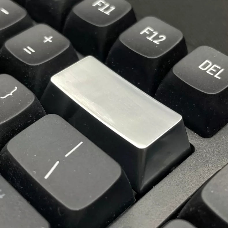 Metal material keycaps, personalized keycaps for large key positions. Metallic texture without engraving