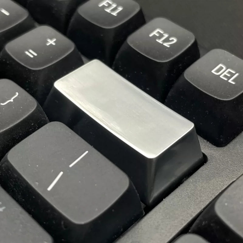 Metal material keycaps, personalized keycaps for large key positions. Metallic texture without engraving