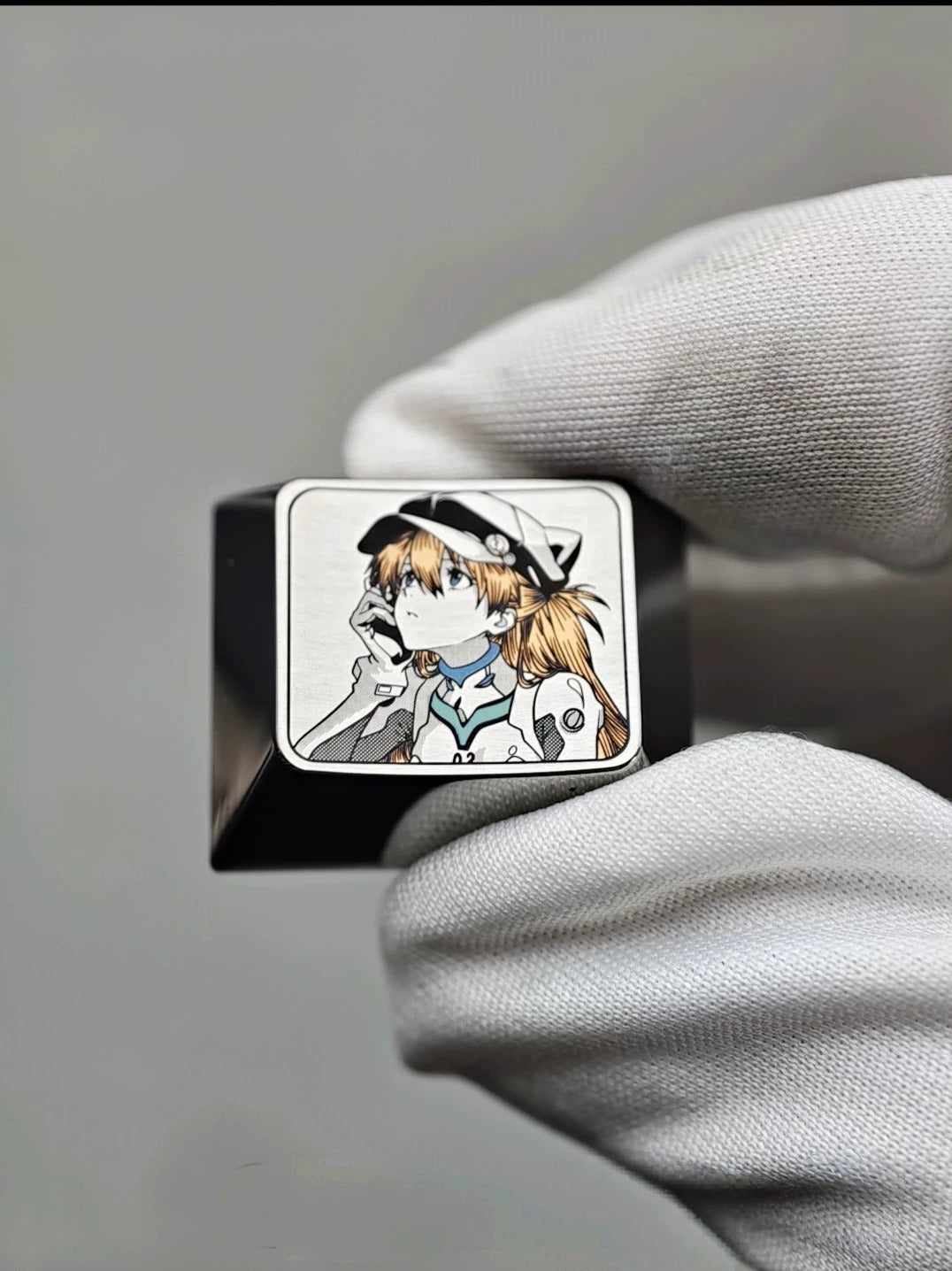 EVA, wear a hat Asuka themed intricately carved lines 1.25 U titanium alloy metal personalized keycaps, anime and game character peripheral products, decorative keycaps.