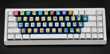 Pok é mon titanium alloy, 26 letter key set/7 character key set. Metallic personalized keycaps.