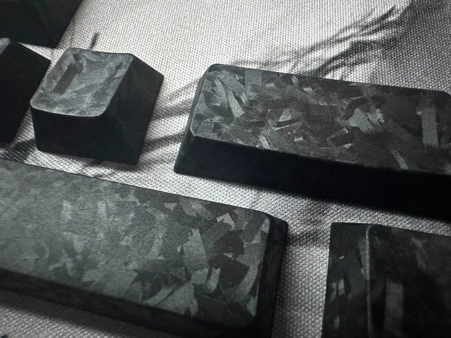 Really Carbon fiber, made with genuine carbon powder pressing process, with a frosted feel, anti slip and non oiling personalized keycap set