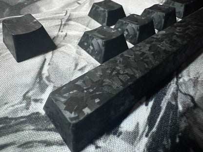 Really Carbon fiber, made with genuine carbon powder pressing process, with a frosted feel, anti slip and non oiling personalized keycap set