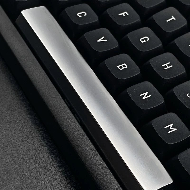 Metal material keycaps, personalized keycaps for large key positions. Metallic texture without engraving