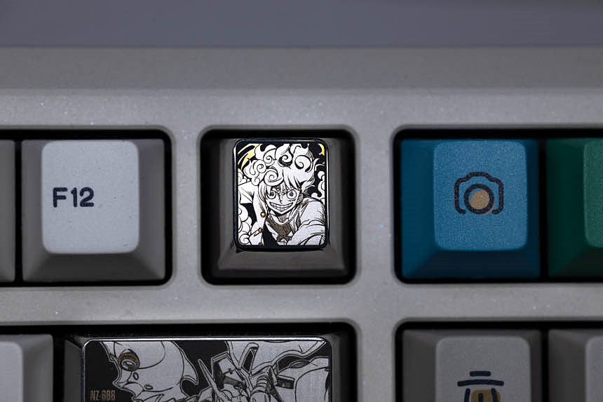 One Piece, Luffy Nika shaped 1U titanium alloy personalized keycap, anime and game cultural and creative decorative keycap.