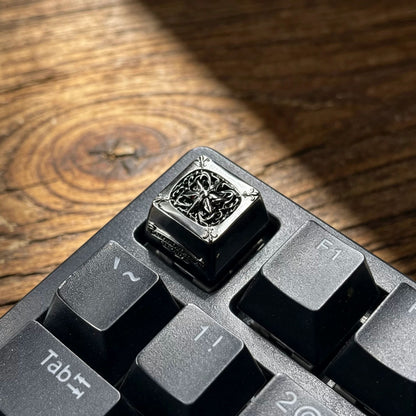 Copper plated black, retro patterned Gothic style metal accented keycaps, metal personalized keycaps, and trendy, artistic keycaps for mechanical keyboards.