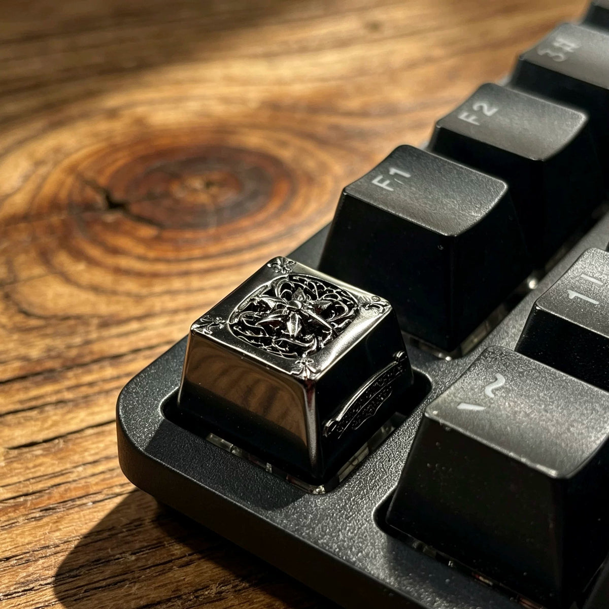 Copper plated black, retro patterned Gothic style metal accented keycaps, metal personalized keycaps, and trendy, artistic keycaps for mechanical keyboards.