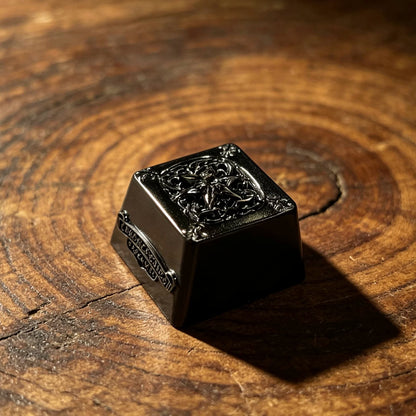 Copper plated black, retro patterned Gothic style metal accented keycaps, metal personalized keycaps, and trendy, artistic keycaps for mechanical keyboards.