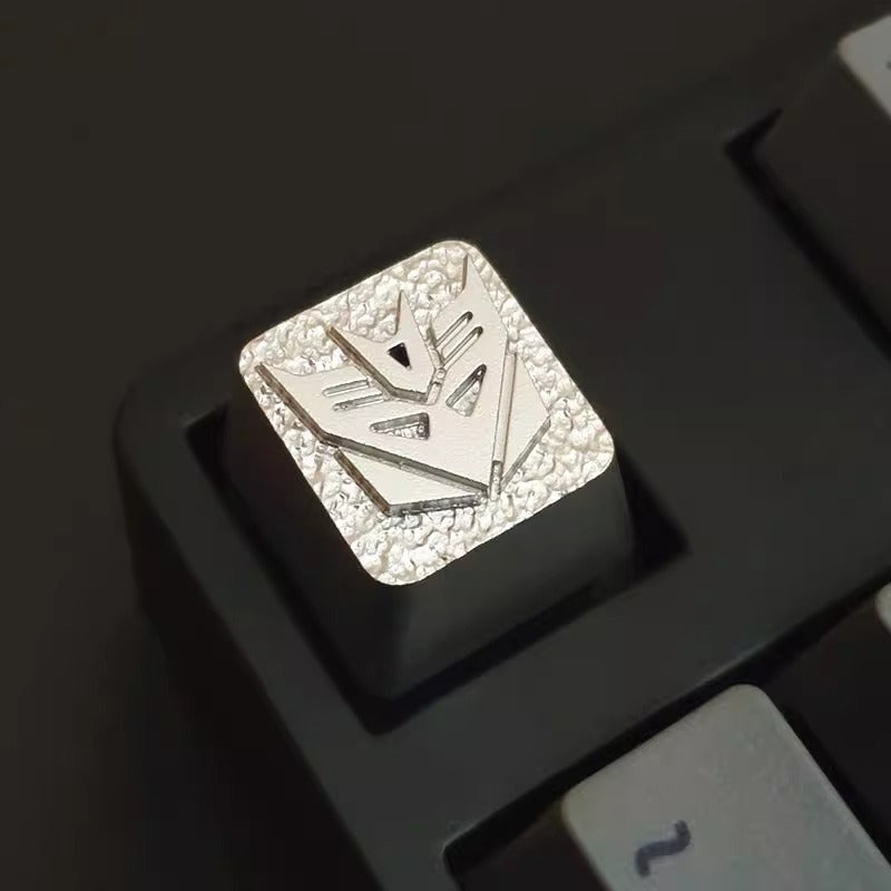Transformers logo, Autobots/Decepticons, metal CNC machining, aluminum alloy personalized keycaps, metal decorative keycaps