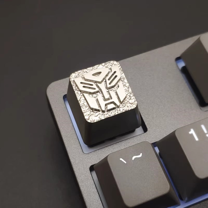 Transformers logo, Autobots/Decepticons, metal CNC machining, aluminum alloy personalized keycaps, metal decorative keycaps