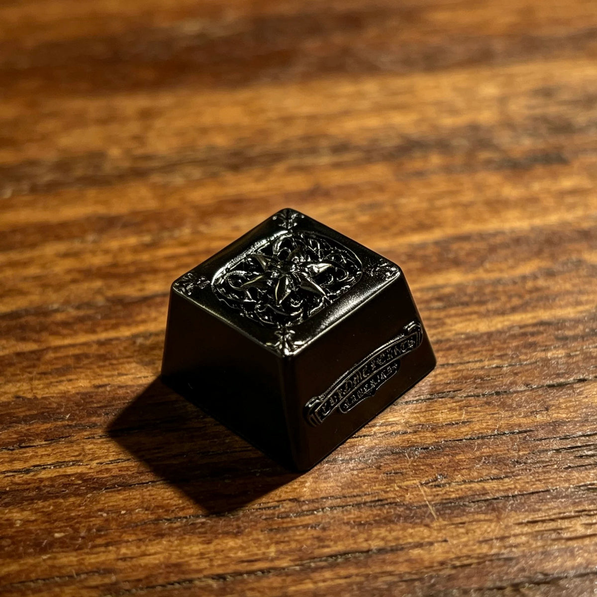 Copper plated black, retro patterned Gothic style metal accented keycaps, metal personalized keycaps, and trendy, artistic keycaps for mechanical keyboards.